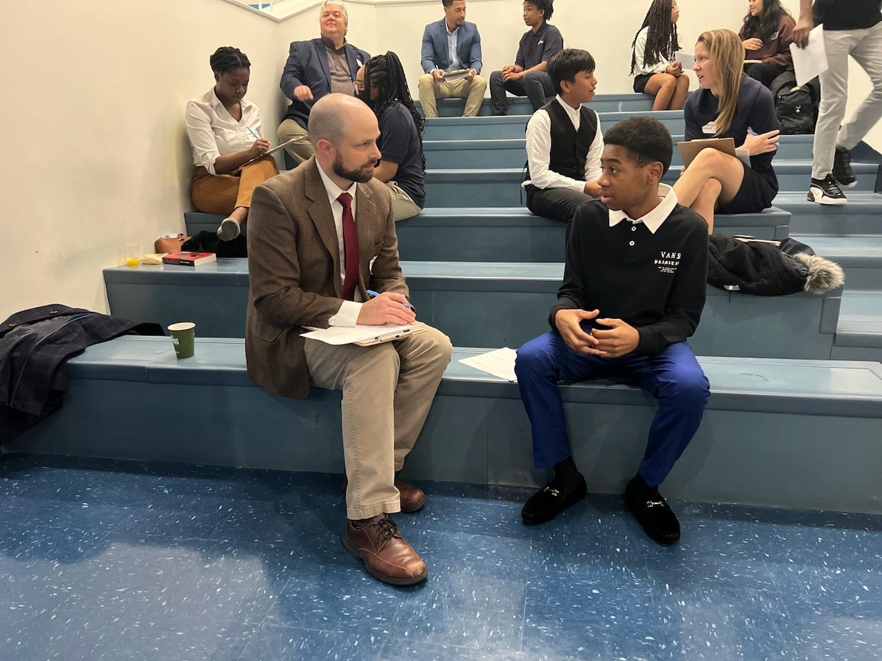 Robert sits with a DC Prep student for a mock interview.